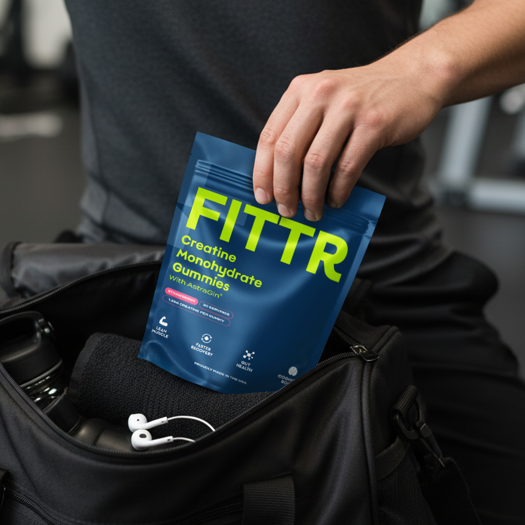 FITTR Creatine Monohydrate Gummies being placed in a gym bag